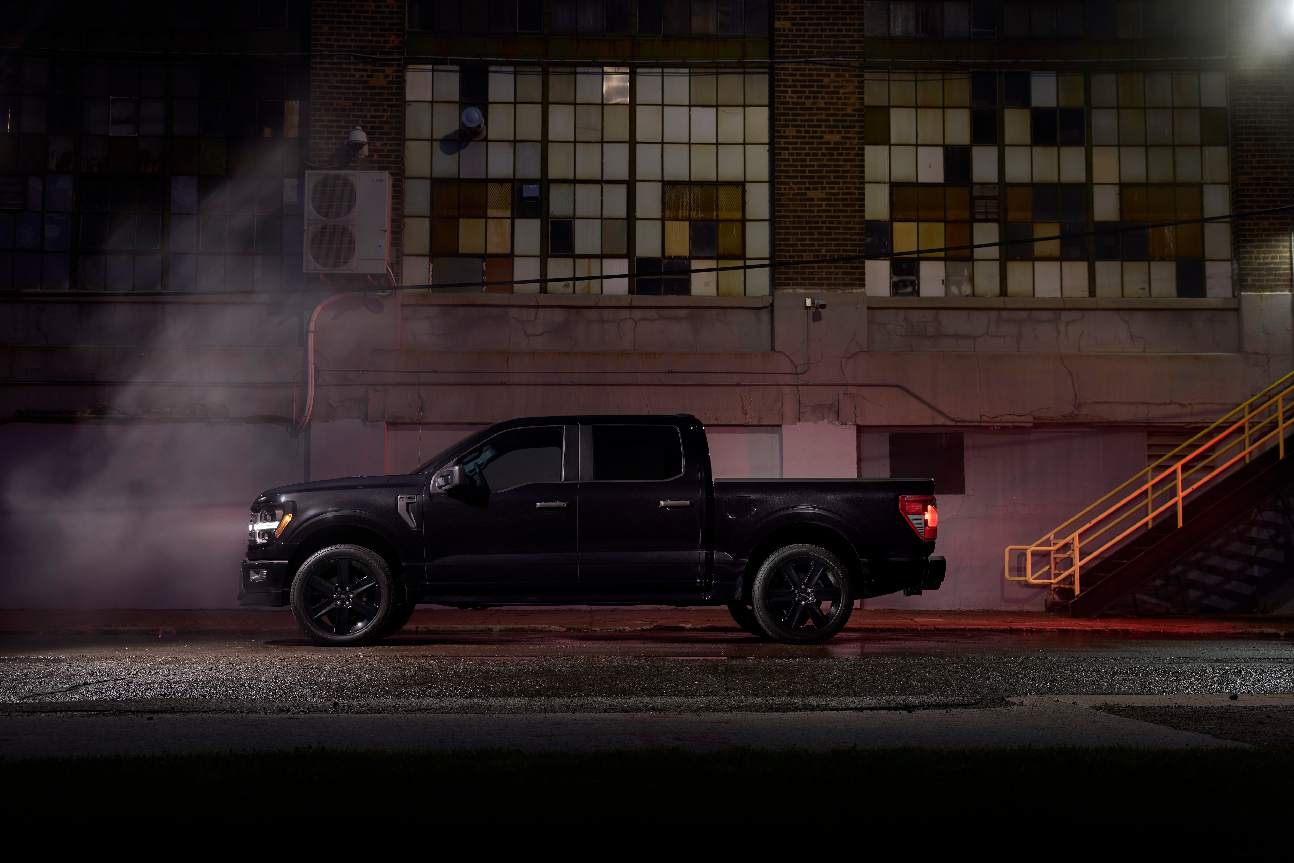 Lengthwide side image of black 2025 Ford F150 Lobo